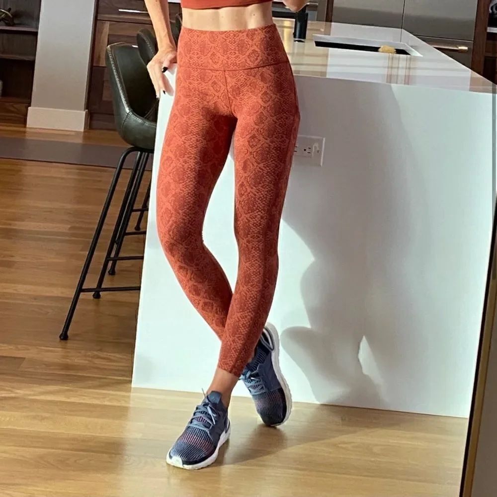 Athleta Ultimate Stash Pocket Snakeskin 7/8 Tight Orange